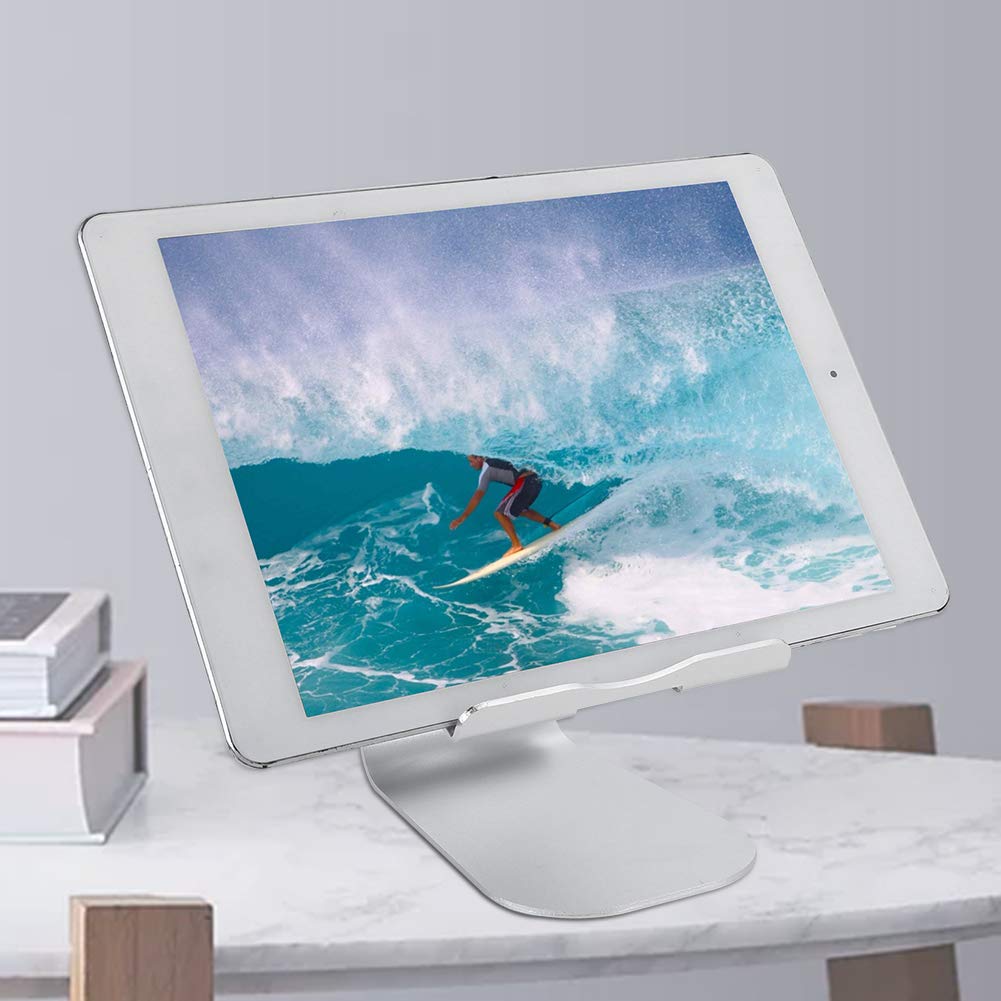 Tablet on a stand displaying an image of a surfer on a wave
