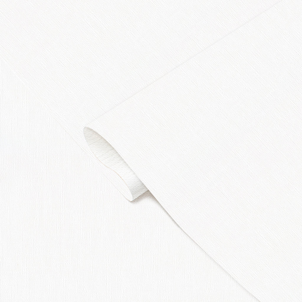 A close-up, high-angle shot of a rolled sheet of white textured wallpaper or fabric, with a subtle horizontal pattern. The sheet is unfurling from the top left towards the bottom right, revealing its clean, bright surface.