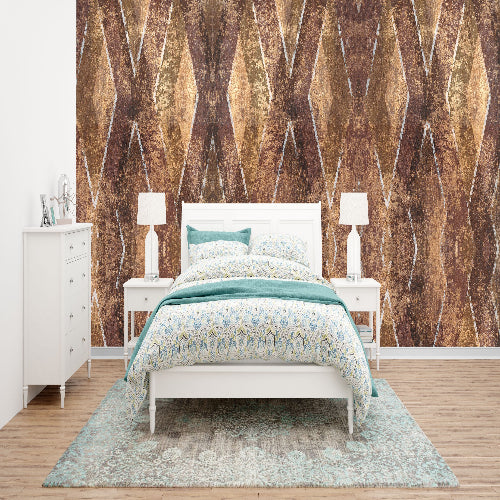 Bedroom with geometric patterned wallpaper, bed, and nightstands.