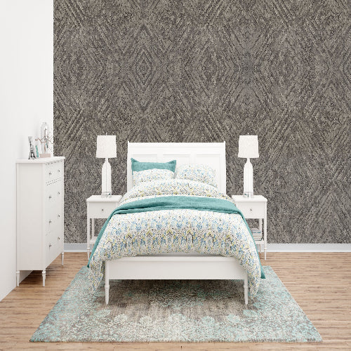 Bedroom with white bed, nightstands, and dresser against a patterned wall.