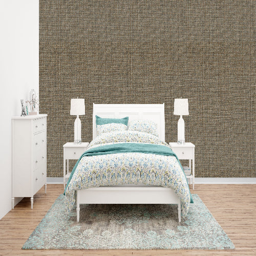 Bedroom with a white bed, blue bedding, and a textured brown wall.