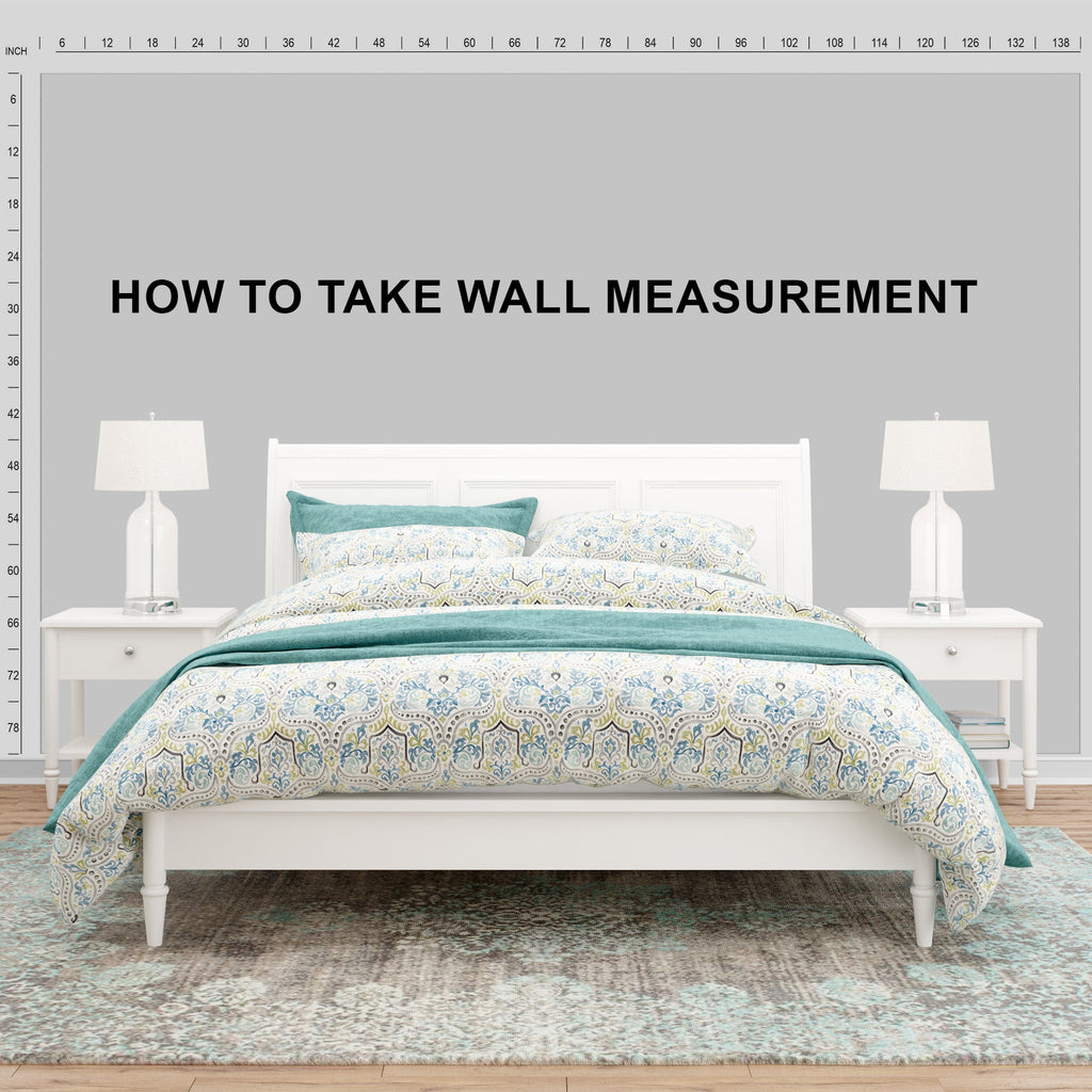 Bedroom setup with a bed, lamps, and a measuring tape on the wall.