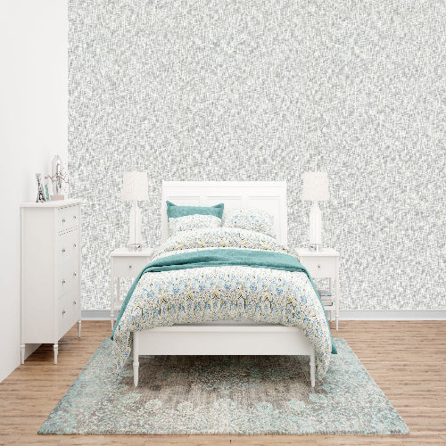 Bedroom with a bed, dresser, and lamps on a light gray background