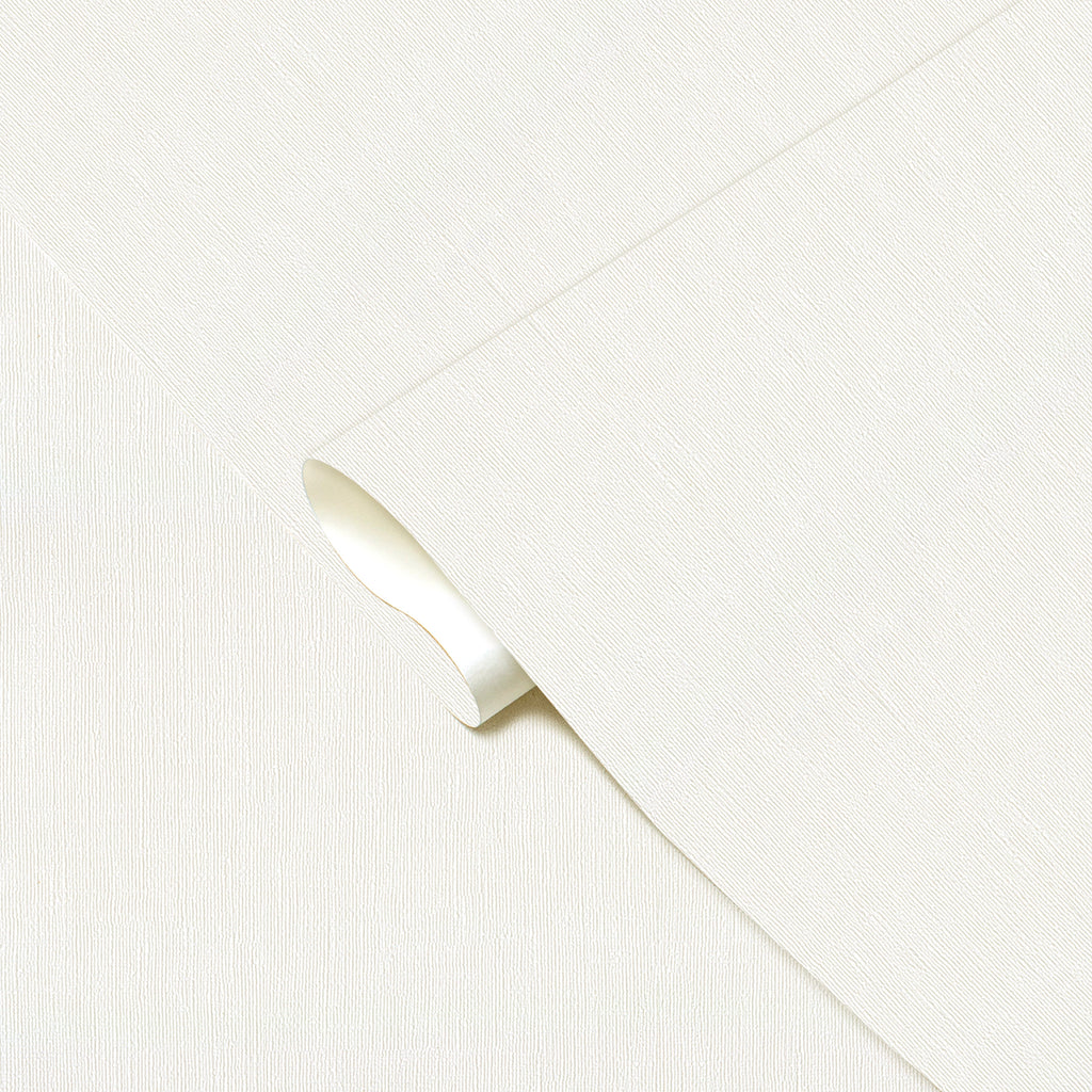 Close-up of a white fabric with a subtle pattern on a light gray background