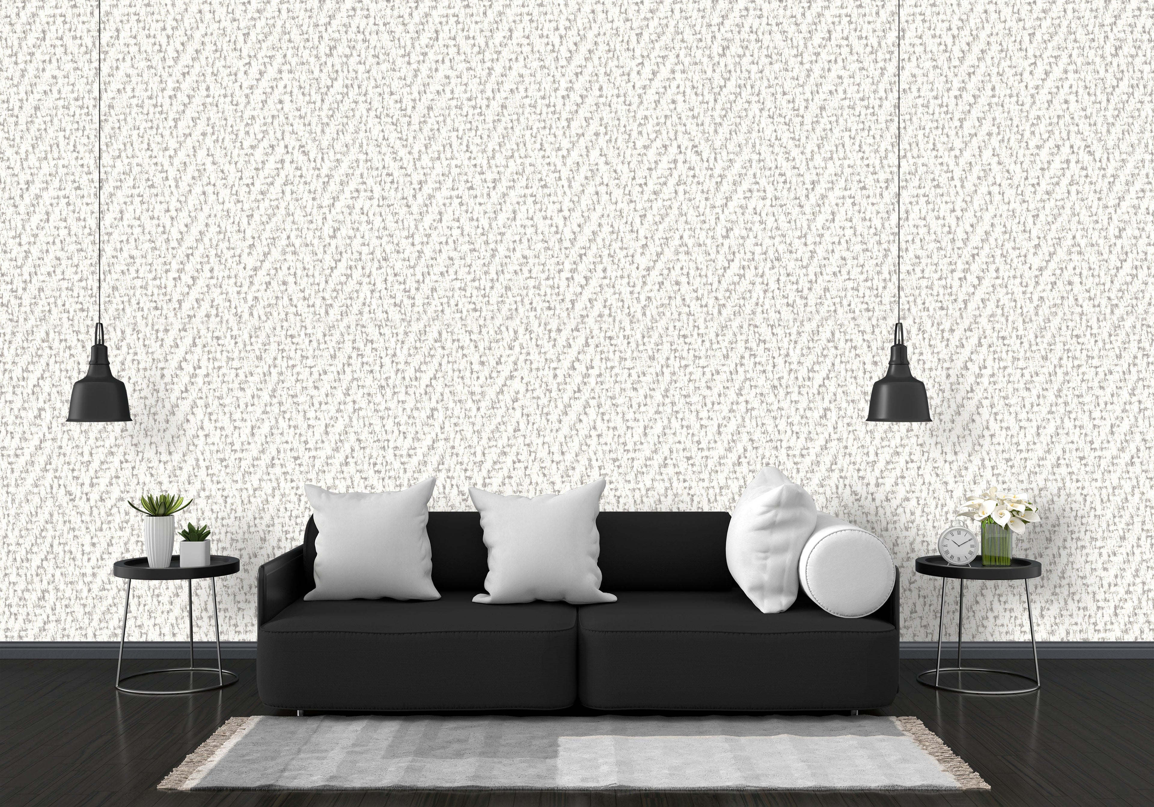 Modern living room with a black sofa, white pillows, and decorative elements against a patterned wall.