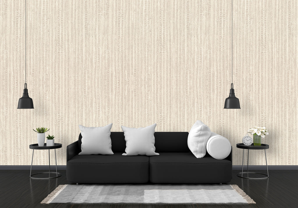 Modern living room with a black sofa, white pillows, and decorative items against a striped wallpaper.