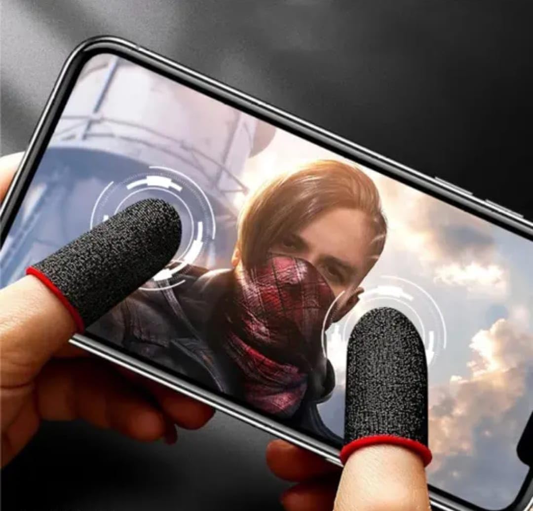 Person using a smartphone with textured finger covers on a blurred background