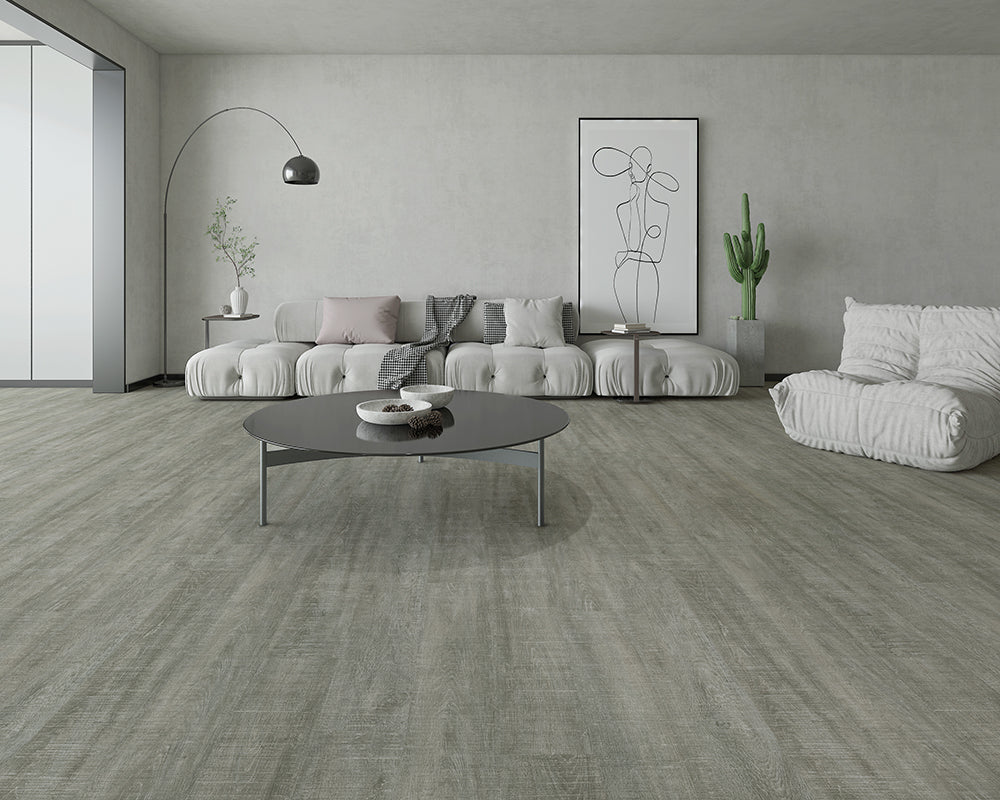 Modern living room with gray flooring, furniture, and decor.