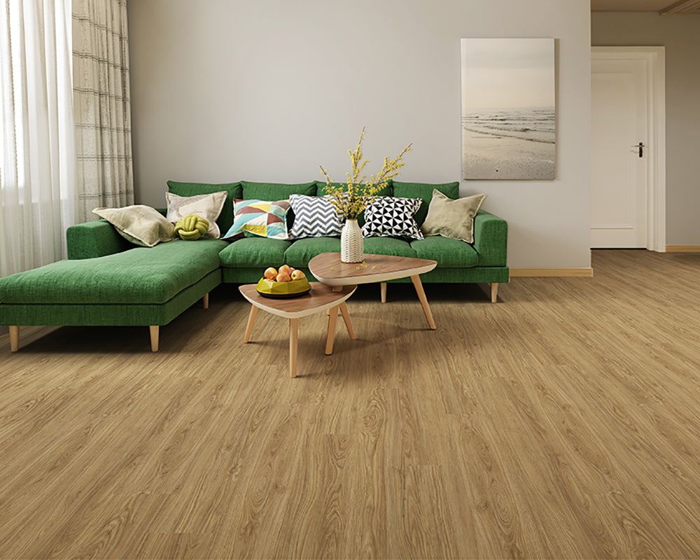 Living room with a green sofa, wooden coffee table, and decorative items.