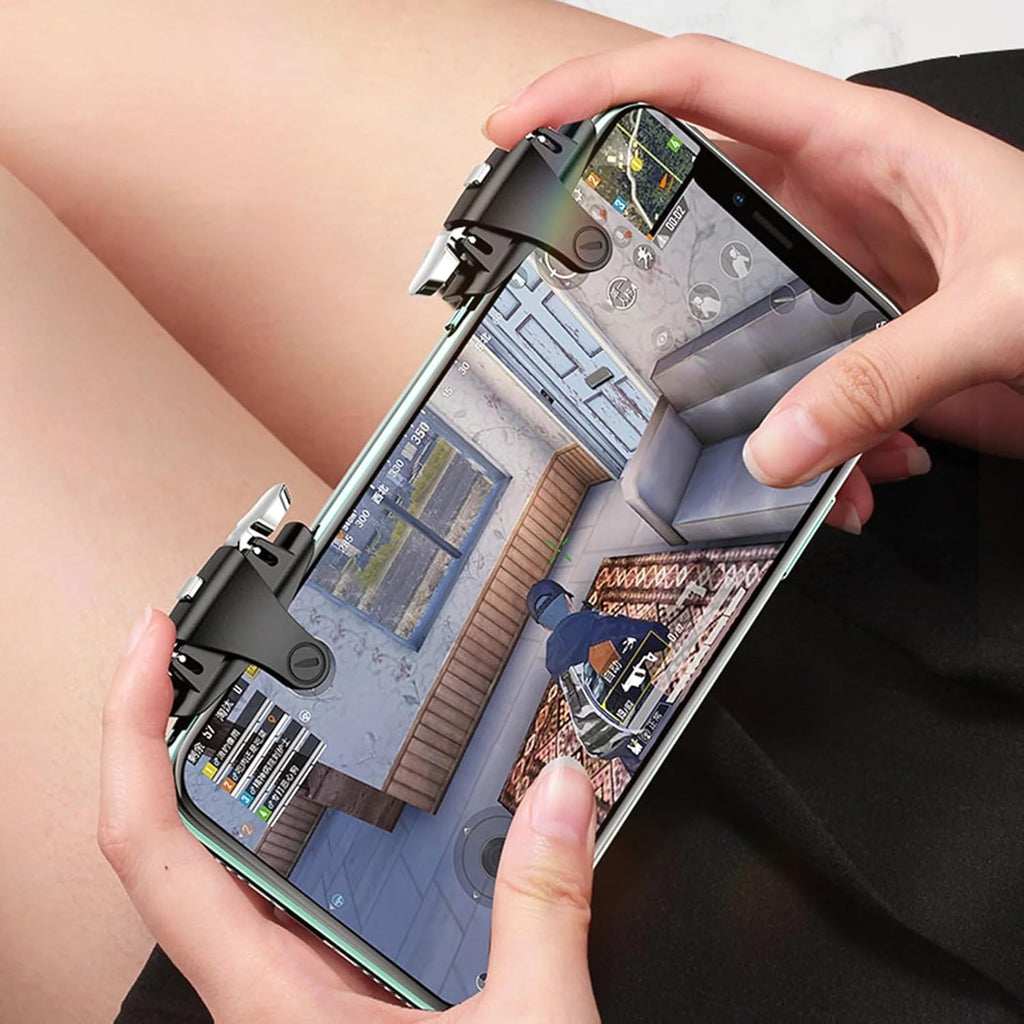 Person holding a smartphone with a game on screen, using a gaming controller attachment.