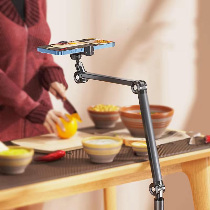 Phone holder on a stand over a kitchen counter with bowls and a person in the background
