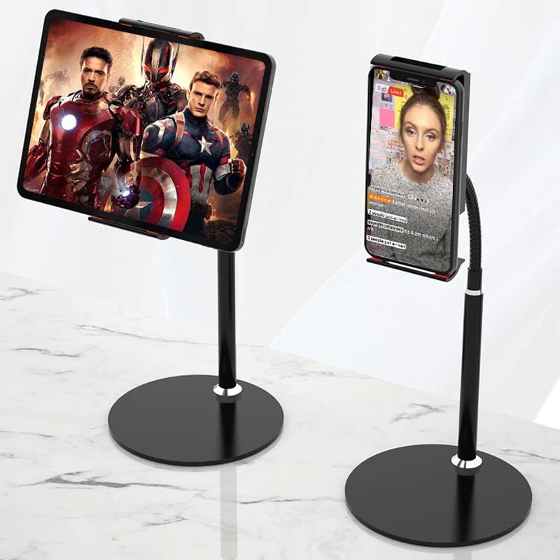 Two black phone stands on a marble surface, one displaying superhero movie posters and the other showing a person.