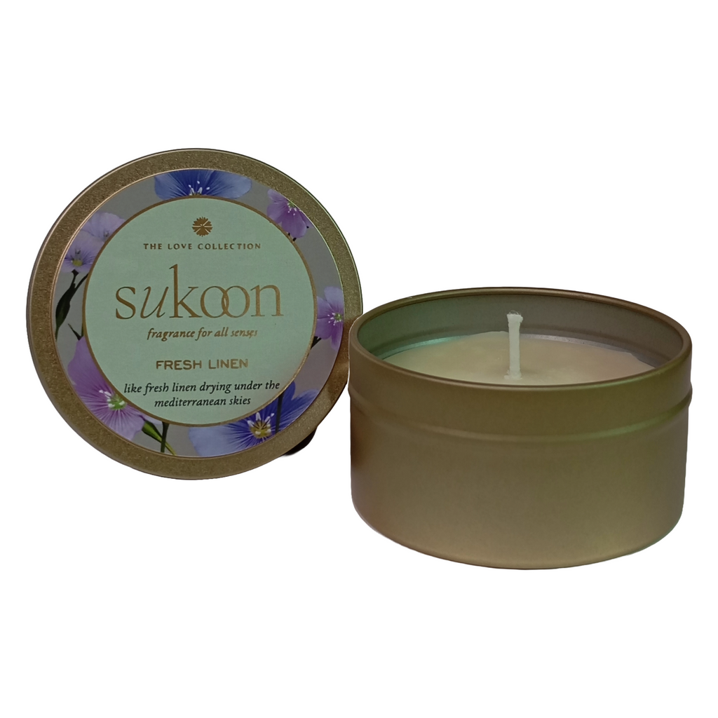 Sukoon candle in a tin with a decorative label on a white background