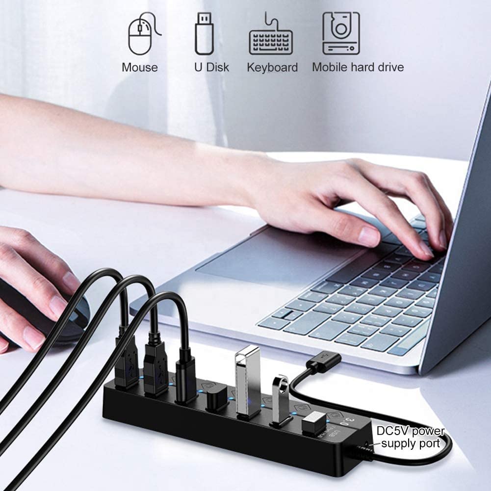 A USB hub with Type c OTG Dongle, multiple USB ports, and individual switches, connected to a laptop, with a person's hands using a keyboard and mouse.