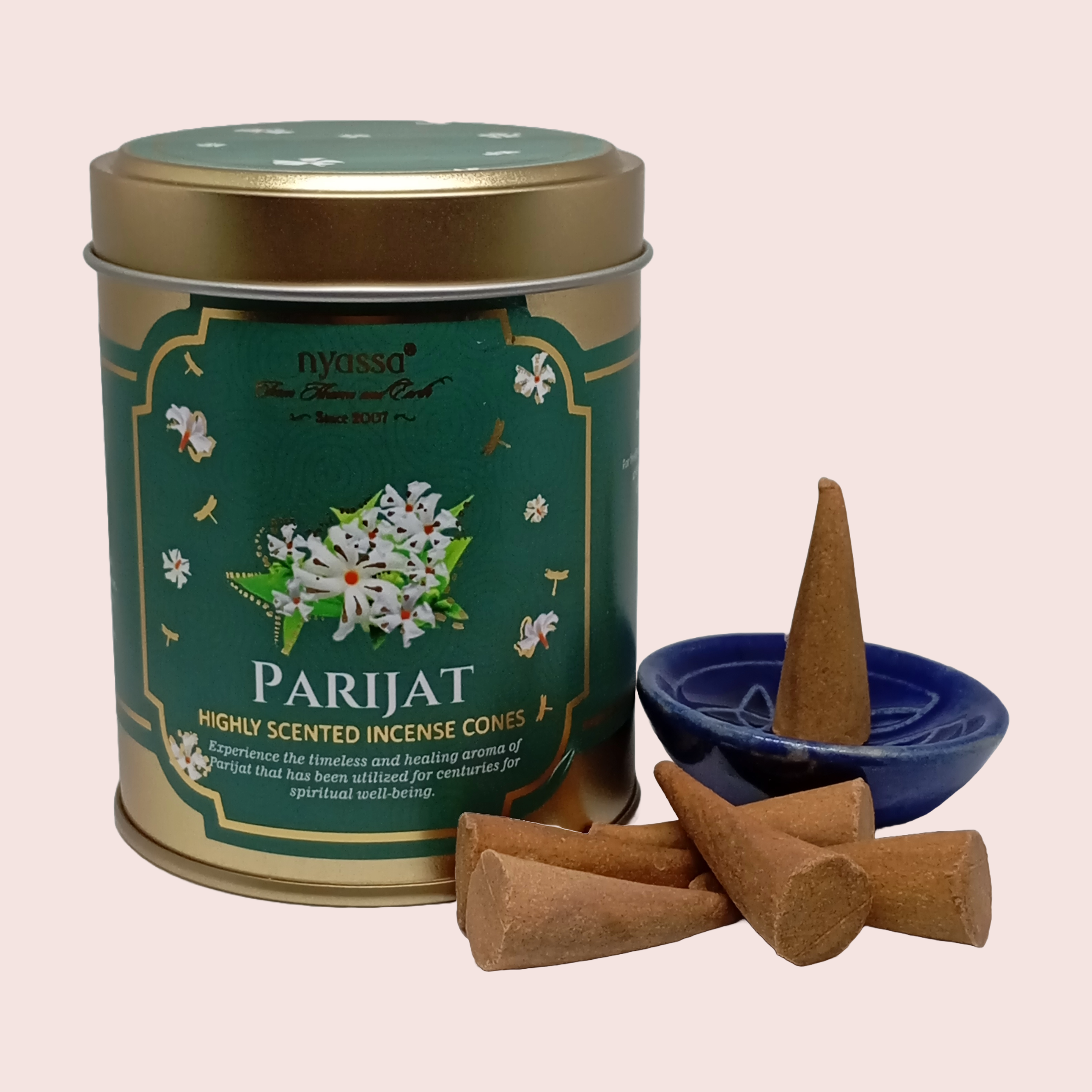 Nyassa Parijat incense cones with a green canister on a light pink background