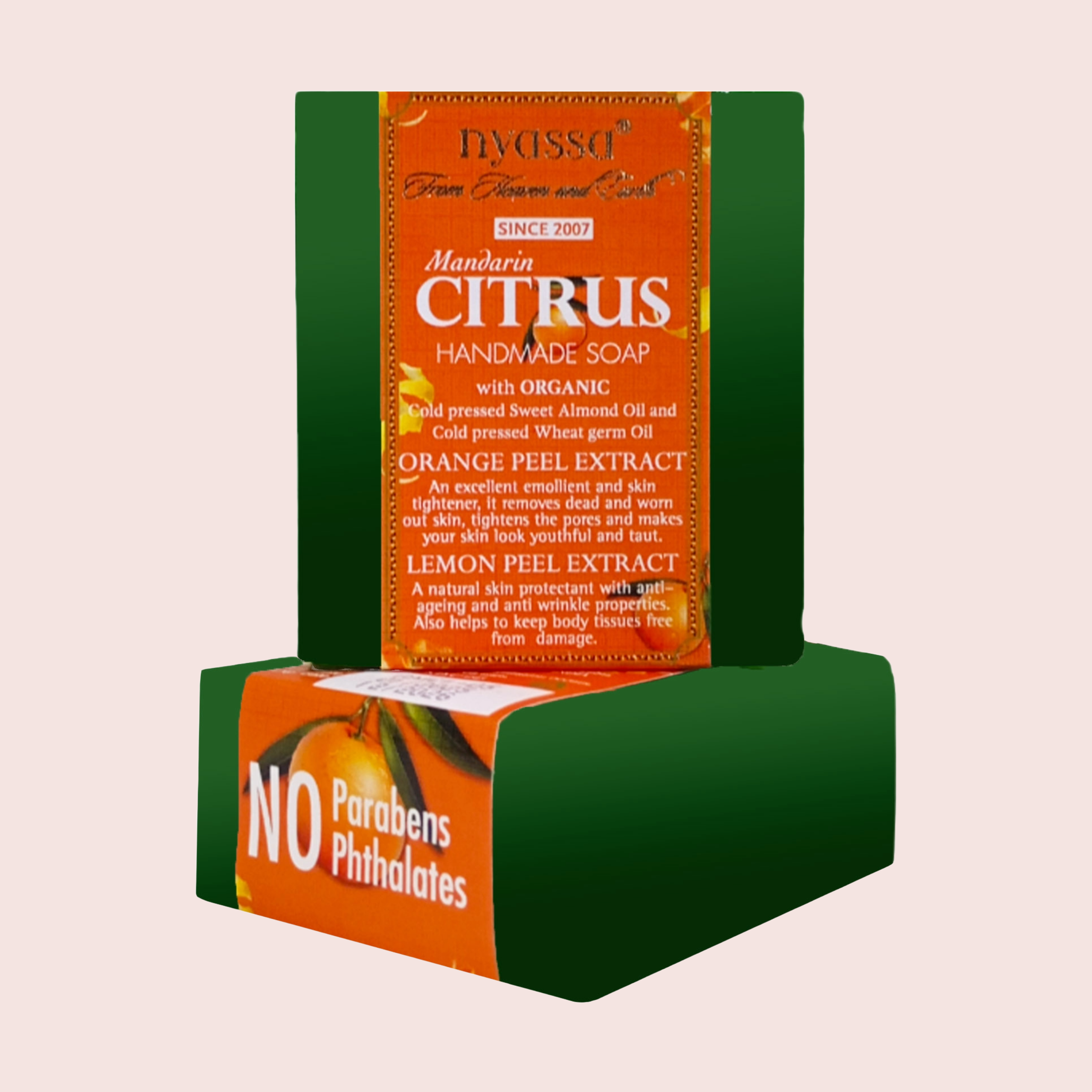 Handmade soap packaging with green and orange design on a beige background