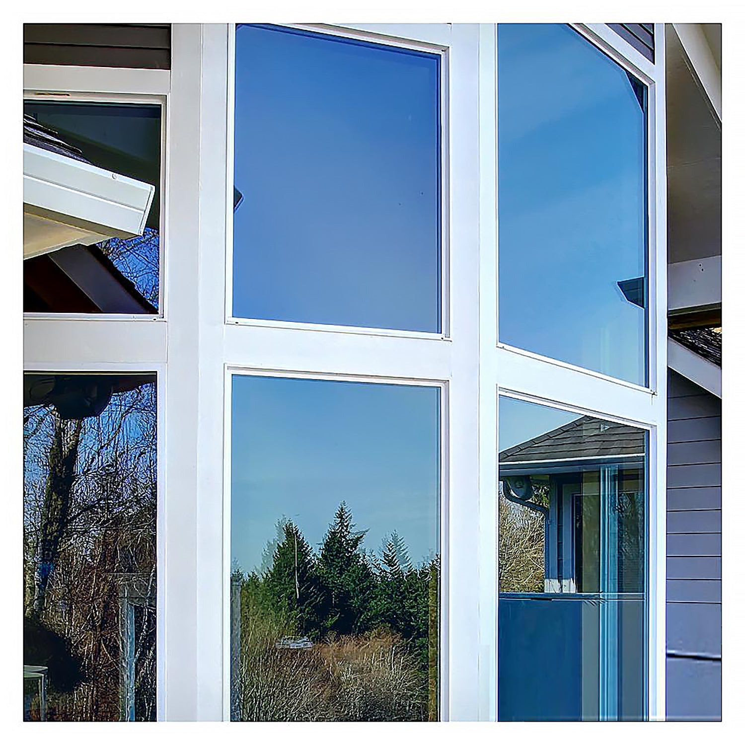 Modern window design with reflective glass panels