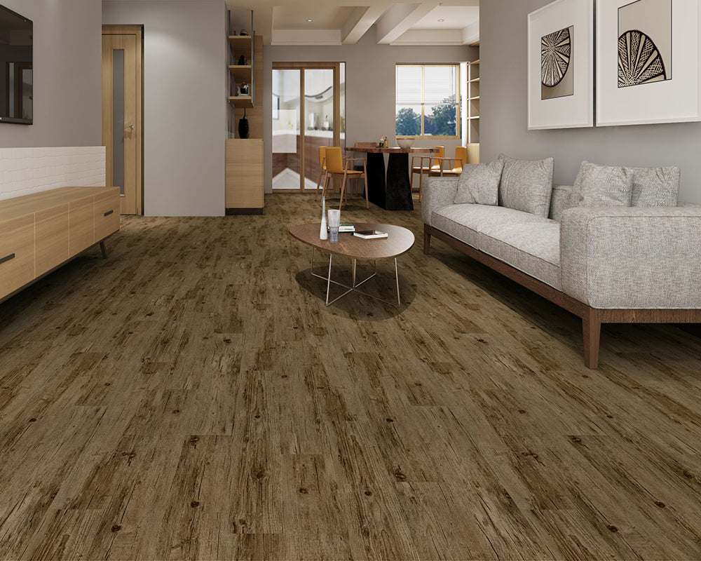Living room with wooden flooring, sofa, and coffee table.