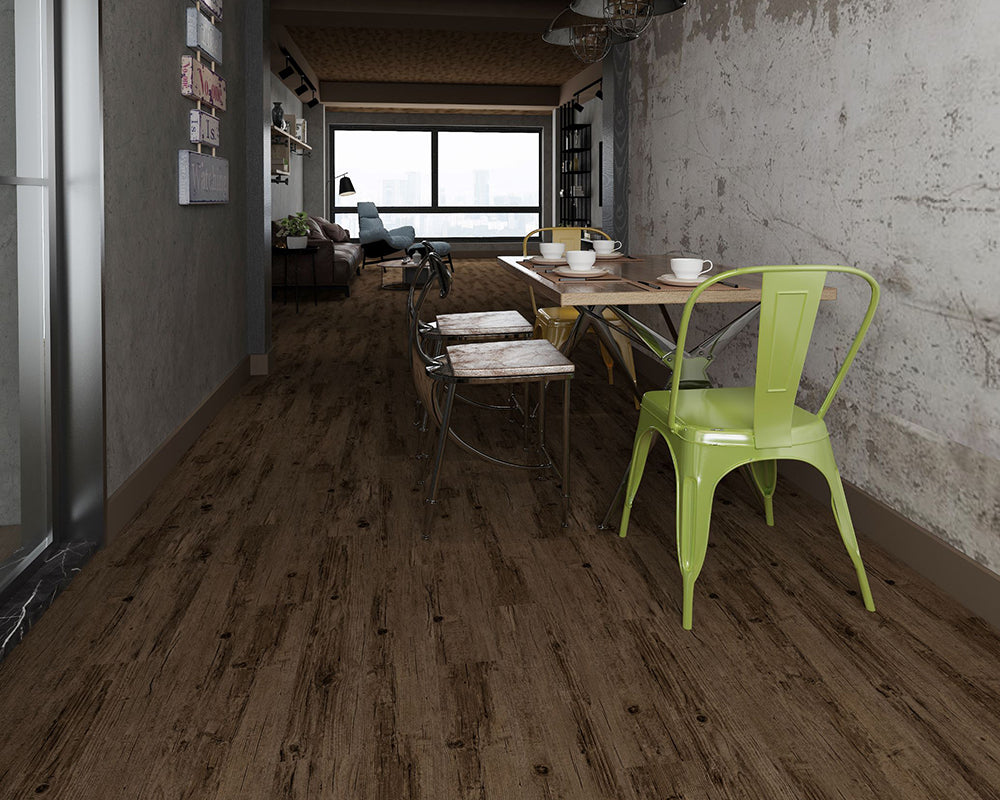 Modern interior with a green chair, dining table, and wooden floor.
