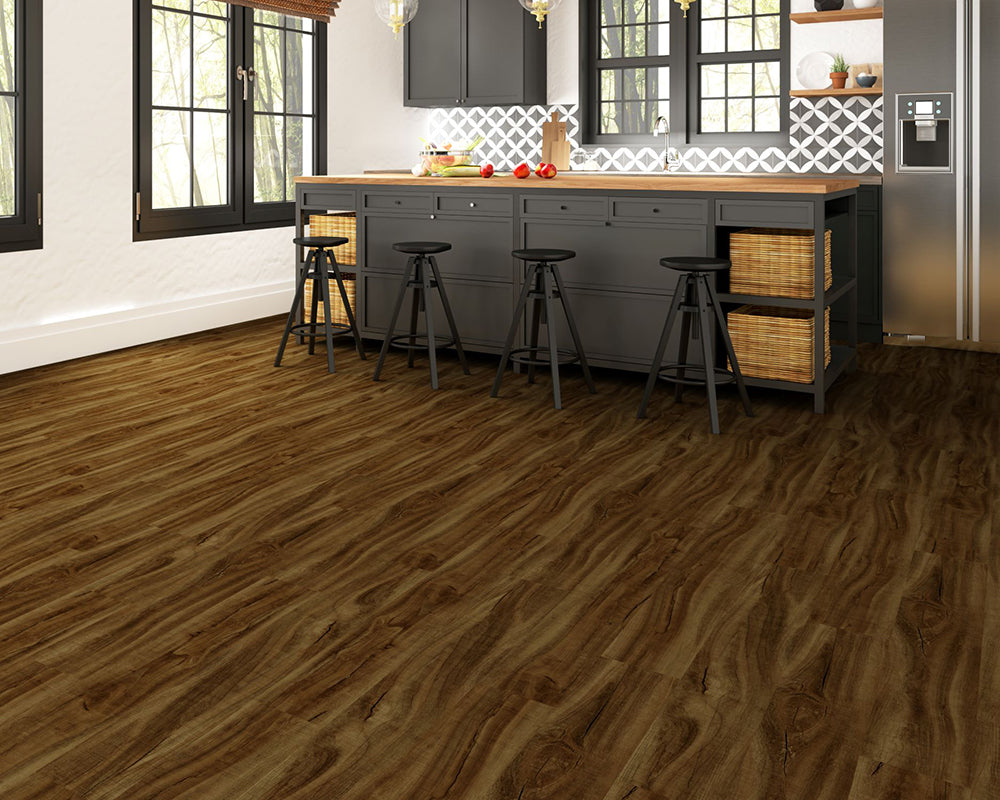 Kitchen with wooden flooring, gray cabinets, and a white backsplash.
